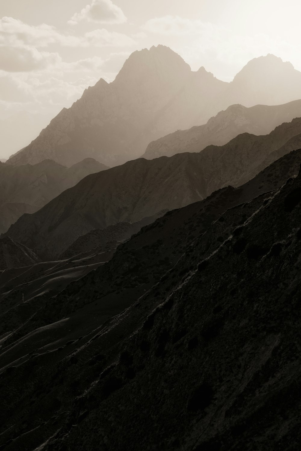 black and white mountains under blue sky during daytime