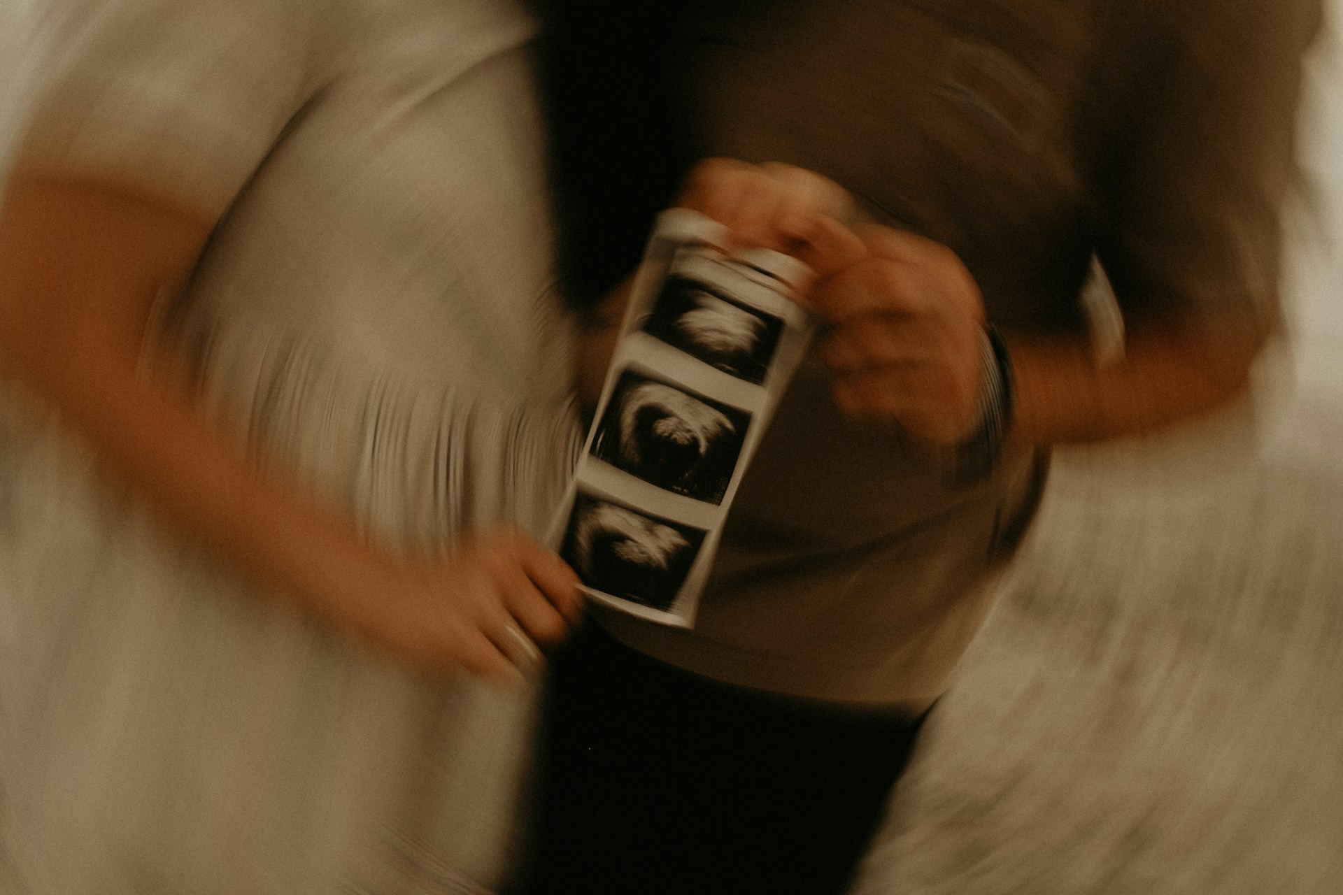 person in white t-shirt and black pants