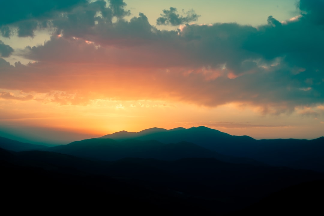 silhouette of mountains during sunset