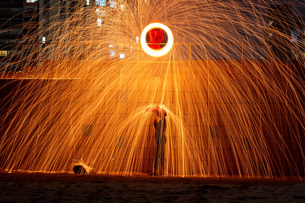 steel wool photography of a city during night time