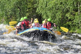 Group of people riding on a raft on a river