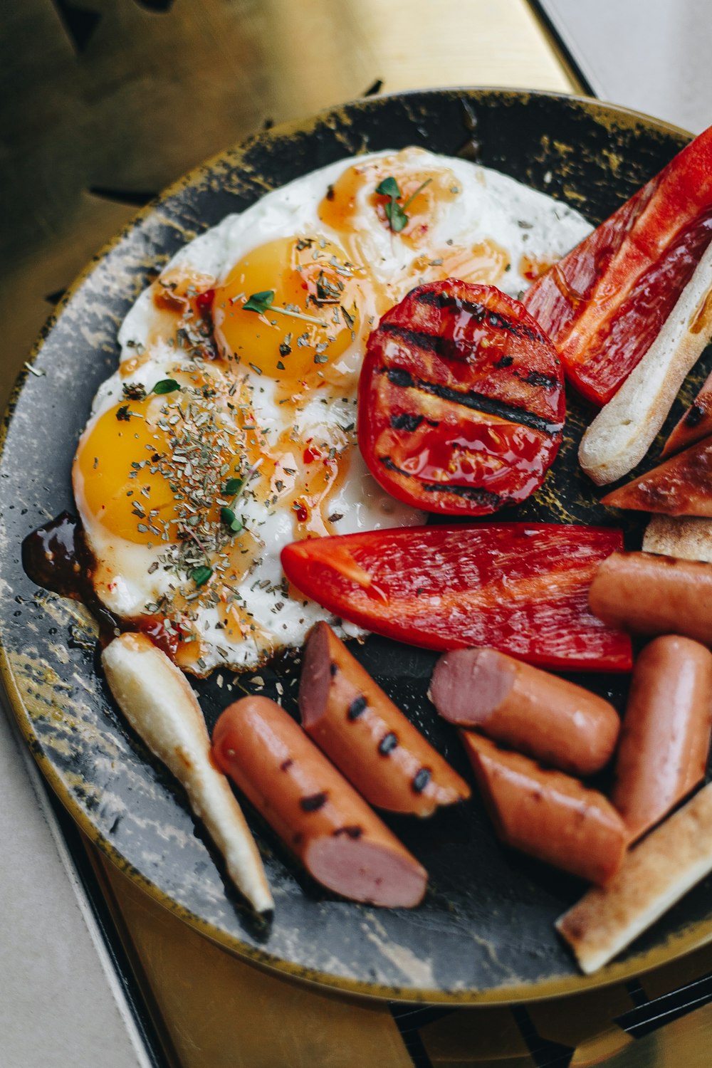 sausage and egg on gray round plate