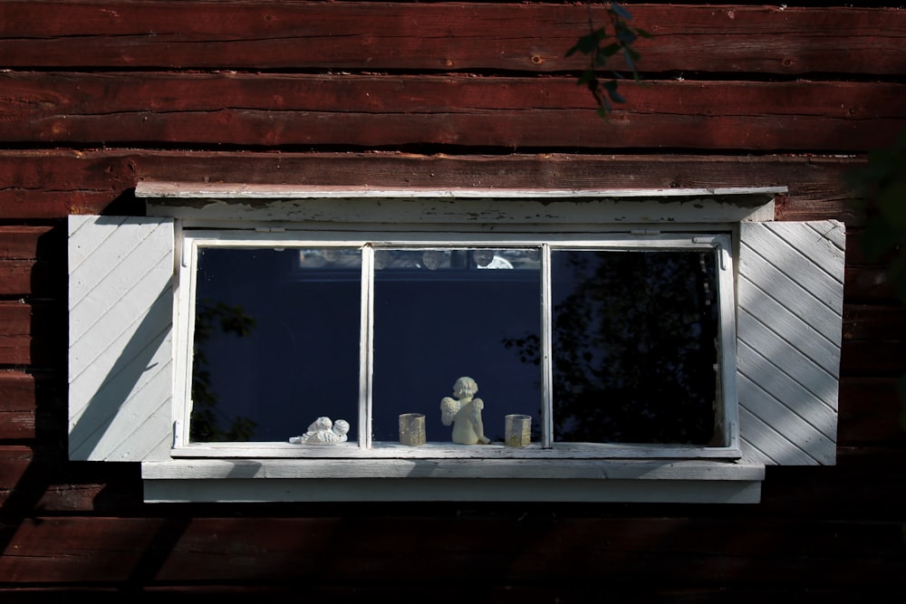 white wooden framed glass window