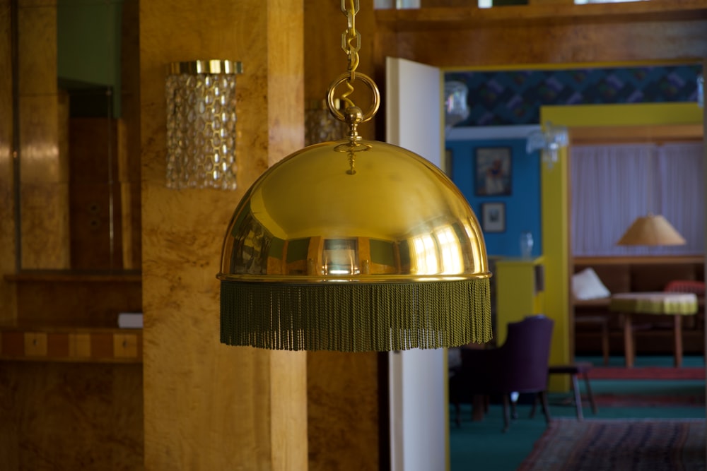 gold and white pendant lamp