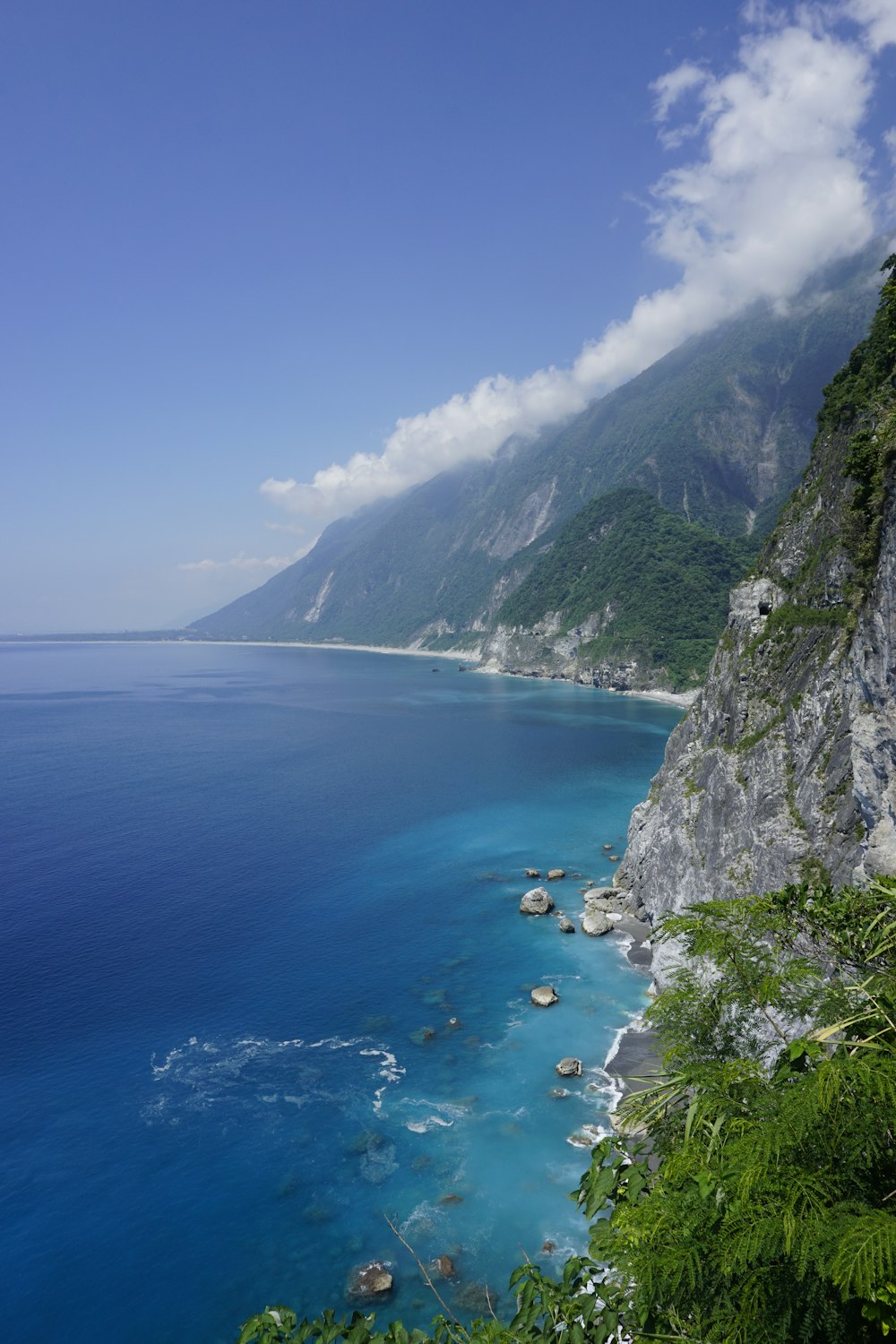 aerial view of body of water between mountains during daytime