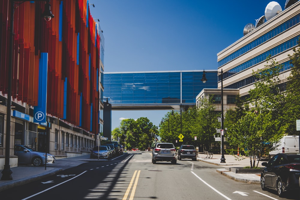 cars parked beside building during daytime