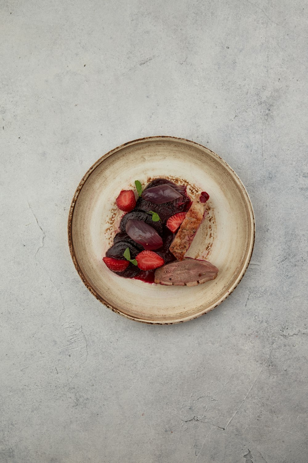 sliced strawberries on brown wooden bowl