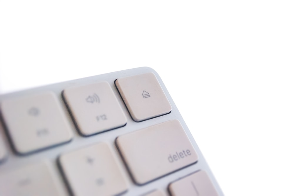 white computer keyboard on white surface