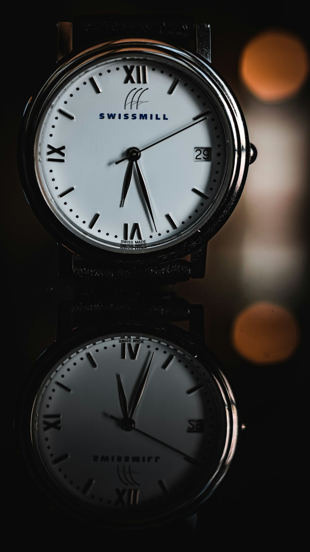 black and white analog watch at 10 10