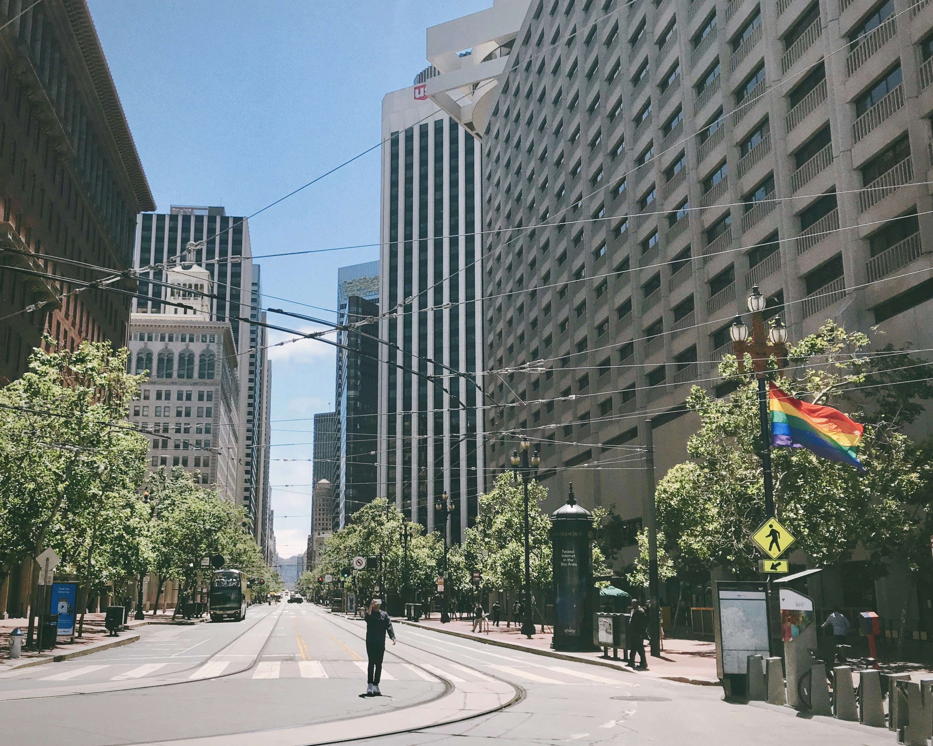 people walking on pedestrian lane near high rise buildings during daytime