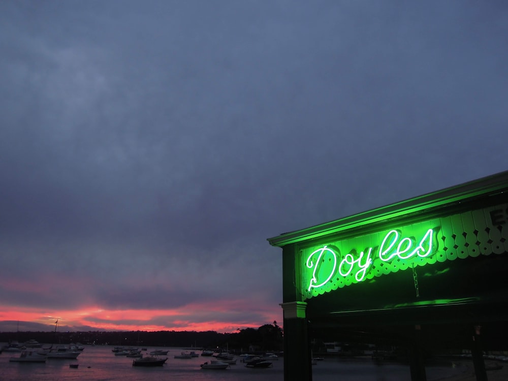 green and white UNKs neon signage