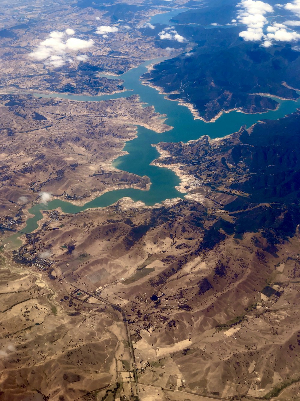 aerial view of lake and mountains