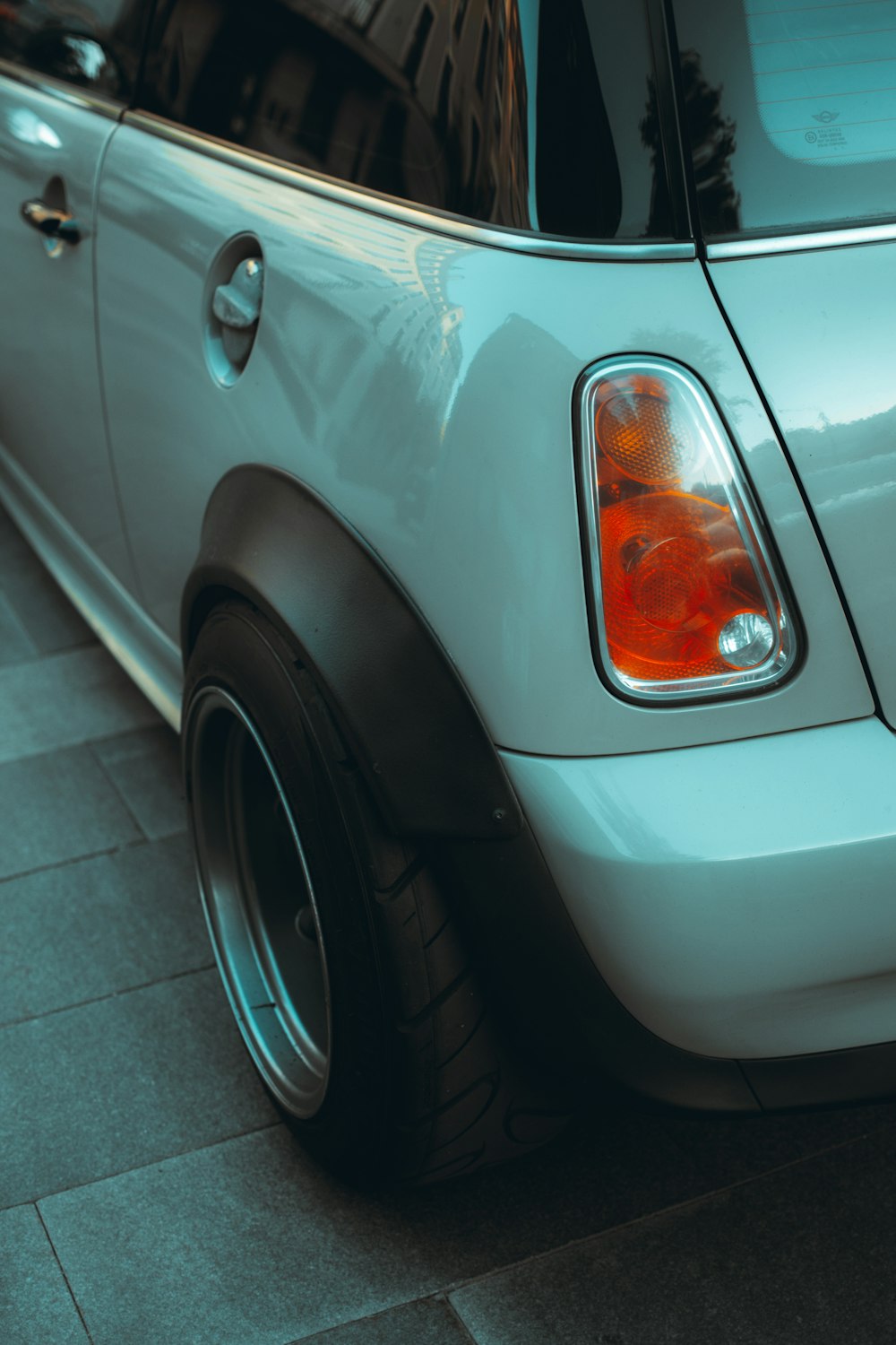 silver car with black wheel