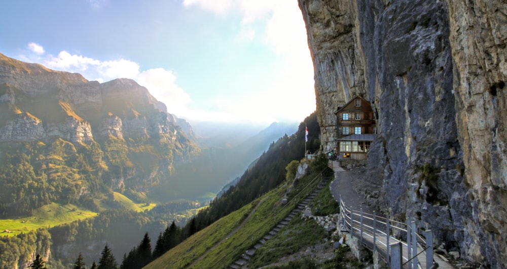 brown concrete building on top of mountain during daytime