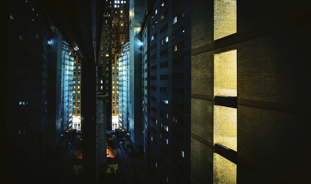 people walking on sidewalk during night time