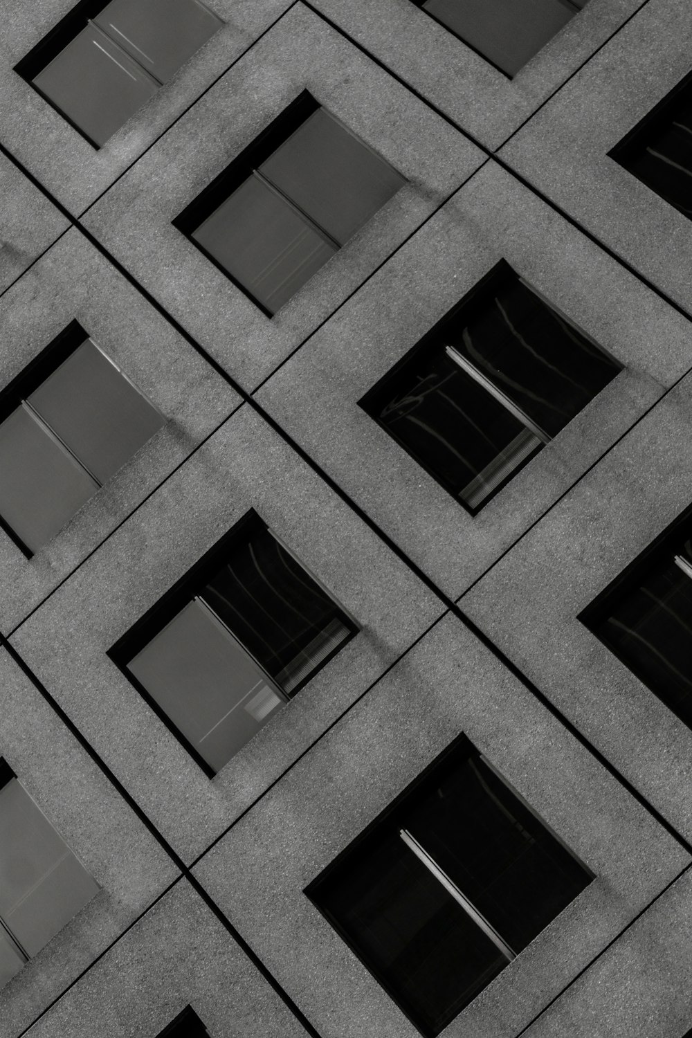 gray concrete building with glass windows