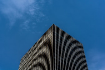 black and white concrete building under blue sky during daytime