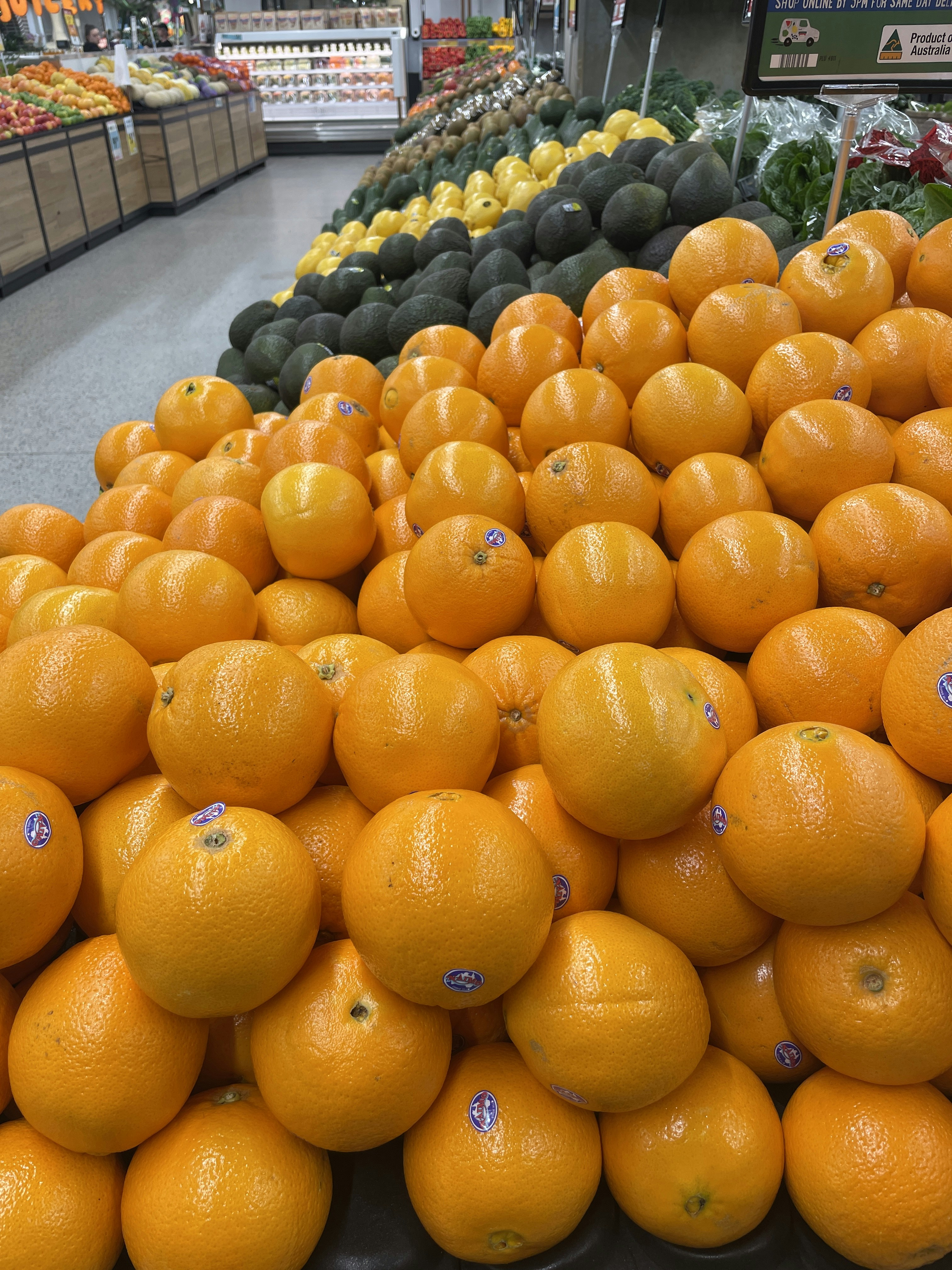 Bright orange navel oranges piled together on display