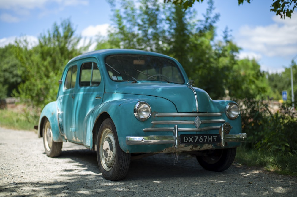 blue volkswagen beetle on road during daytime