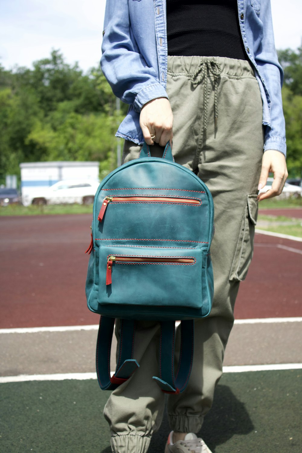 man in blue jacket carrying blue backpack