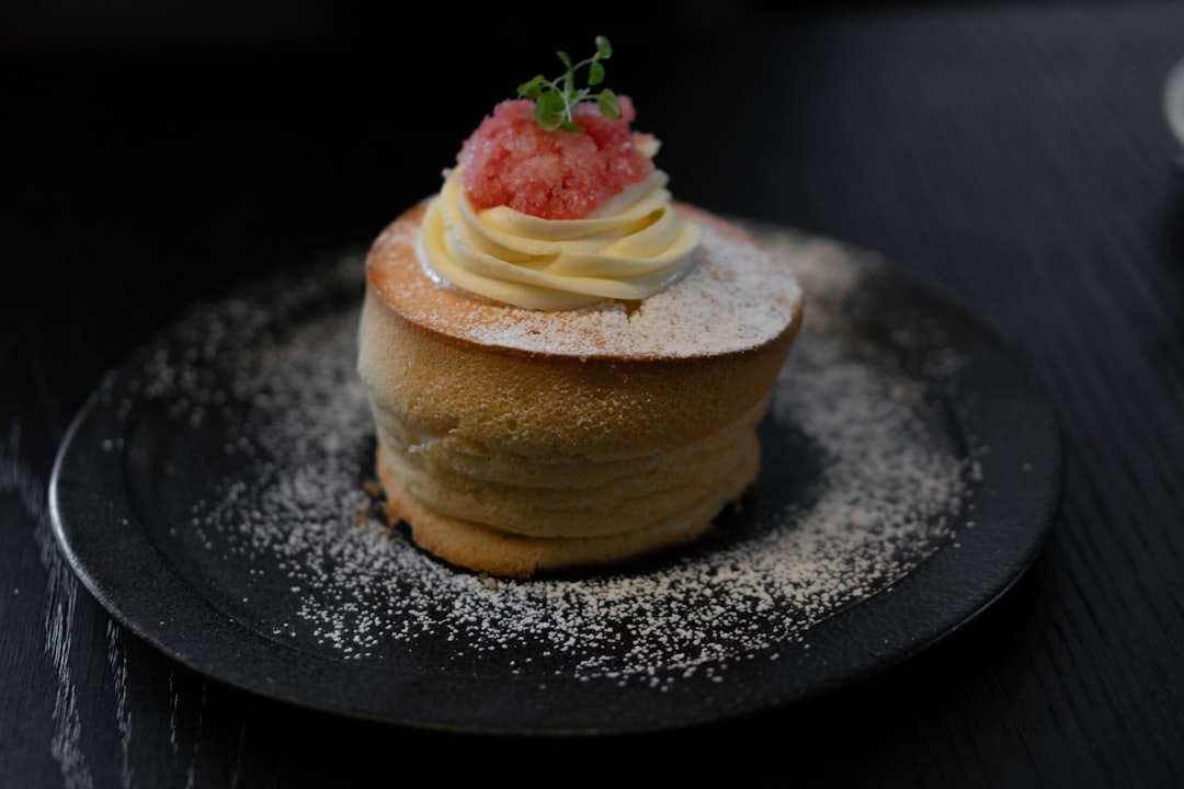 brown cake with strawberry on top