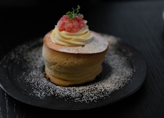 brown cake with strawberry on top