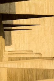 brown wooden staircase with brown wooden railings