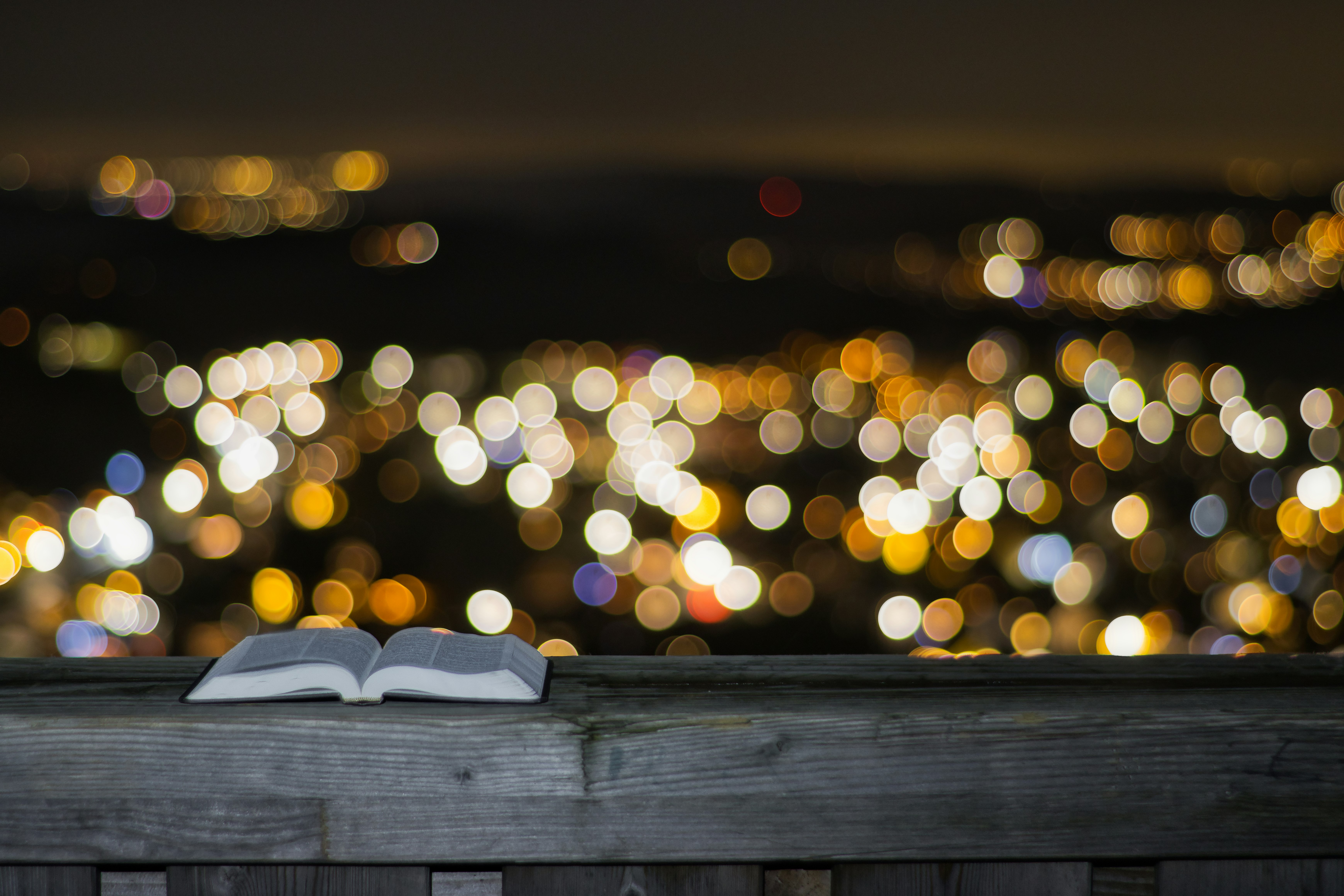 white book on brown wooden table