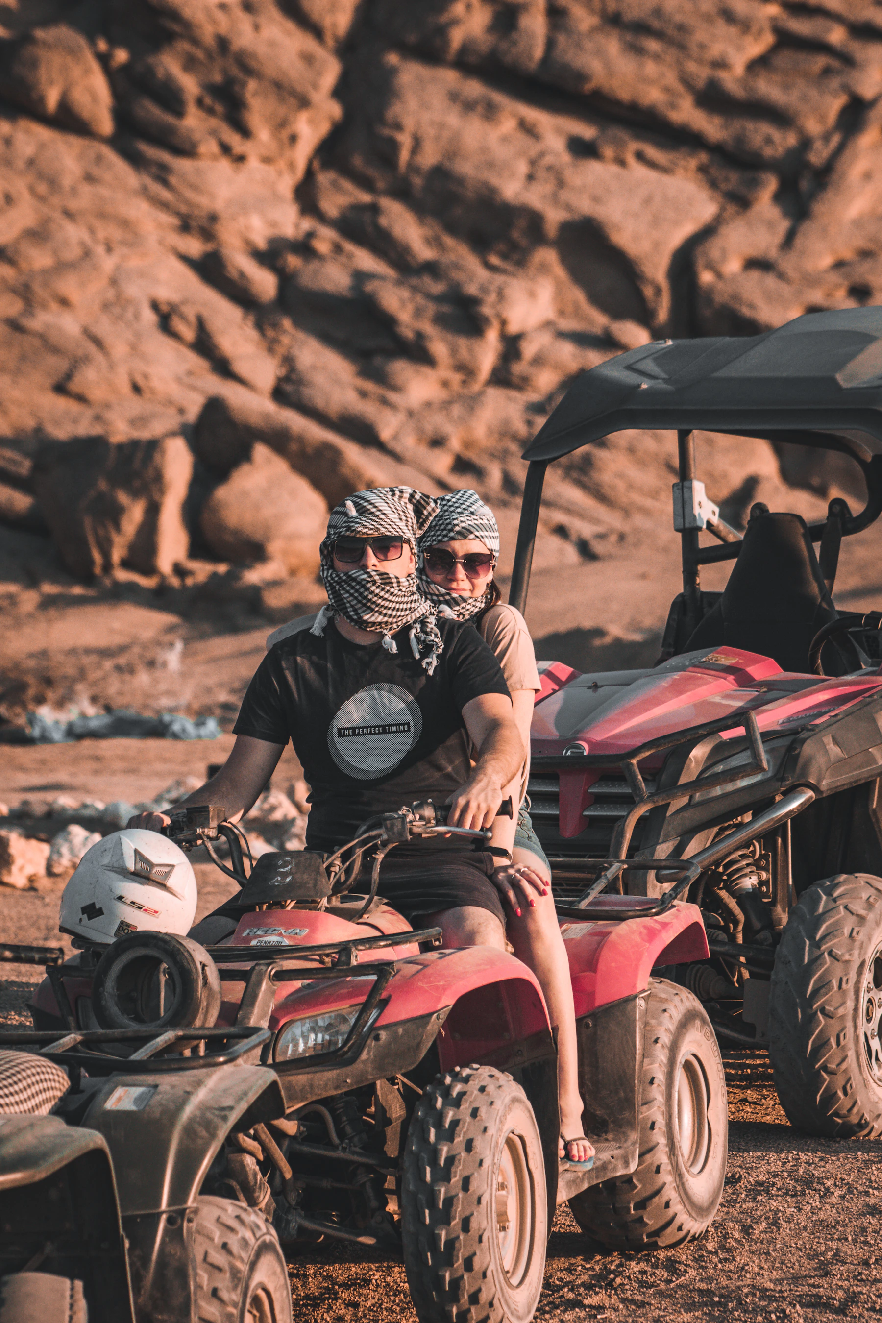 Couple riding a quad bike in the desert near Marrakech