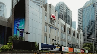 white and red basketball hoop near white concrete building during daytime