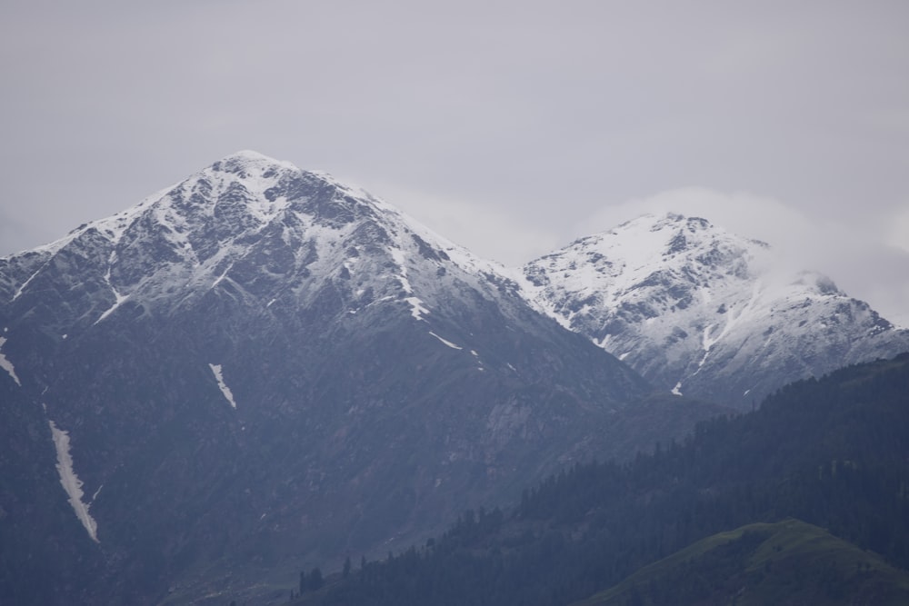 snow covered mountain during daytime