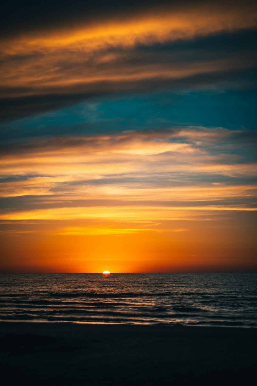 body of water during sunset