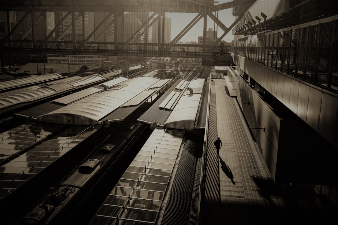 grayscale photo of a train station