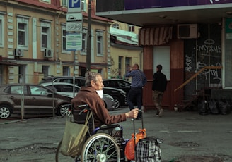 man in black jacket riding on bicycle during daytime