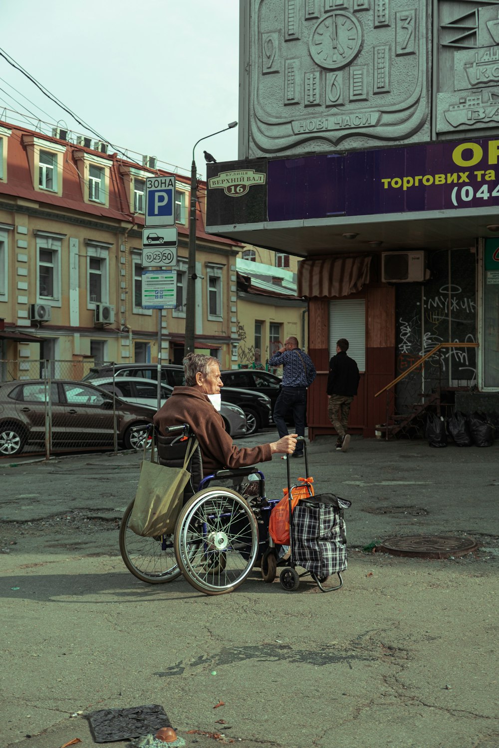 man in black jacket riding on bicycle during daytime