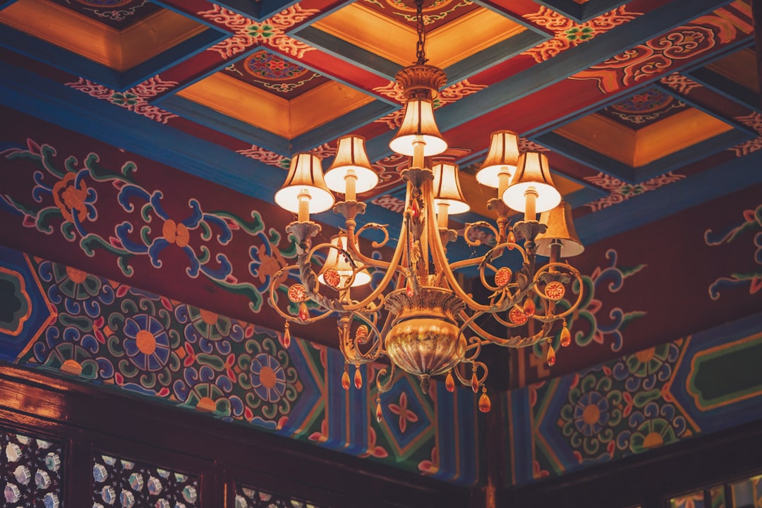 brown and white chandelier turned on inside building