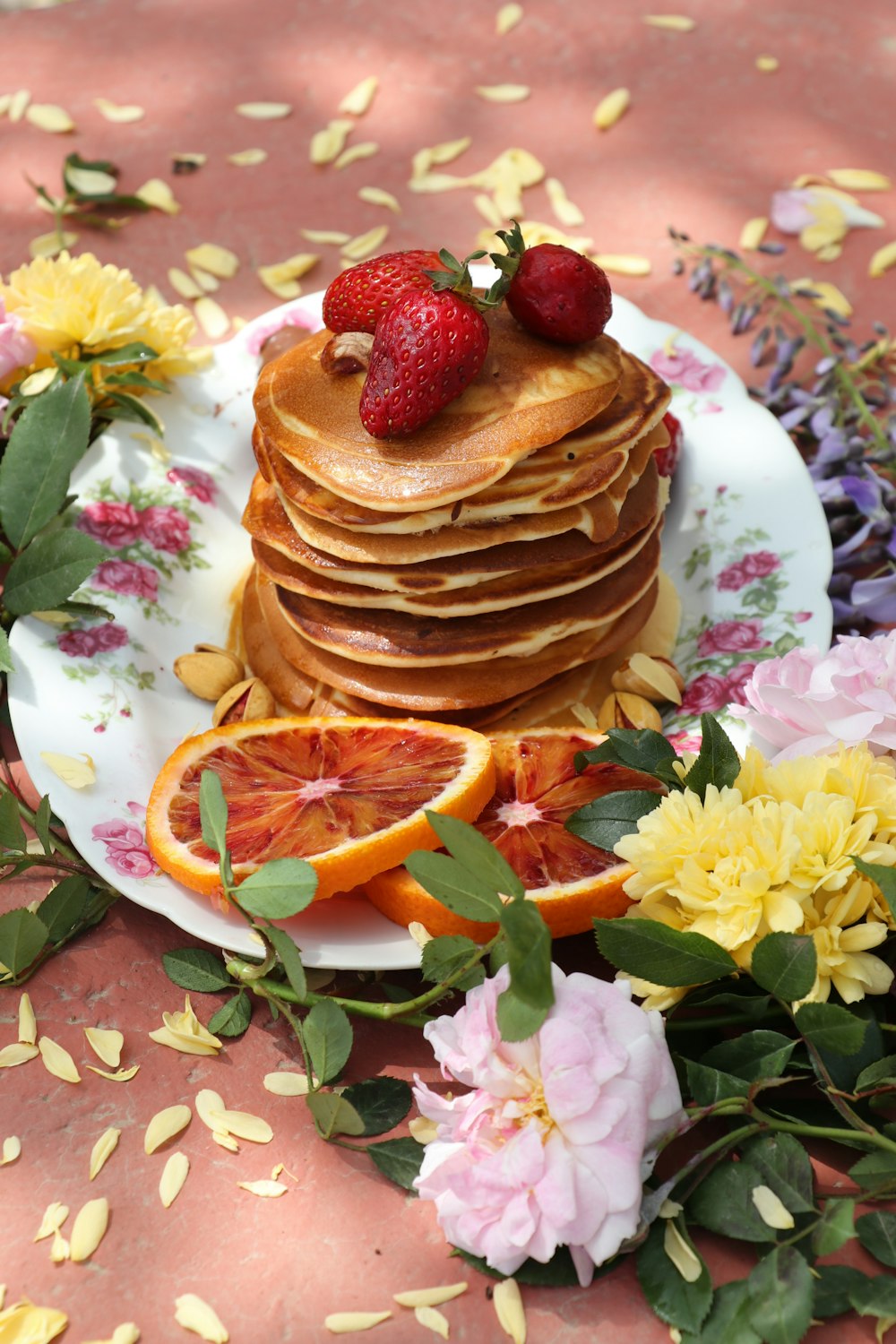 a stack of pancakes sitting on top of a white plate