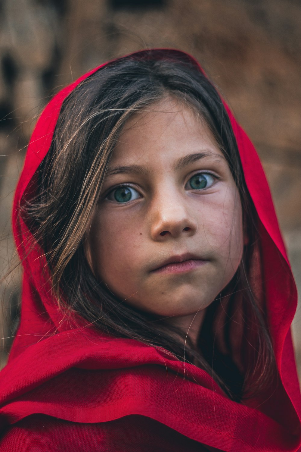 woman in red hoodie with brown hair