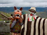 a couple of people with animal masks standing next to each other