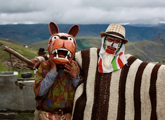 a couple of people with animal masks standing next to each other