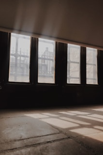 A serene shot of a dojo with sunlight streaming through the windows.