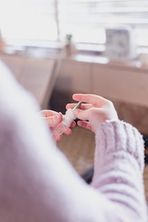 An influencer demonstrating a wellness product in a home setting.