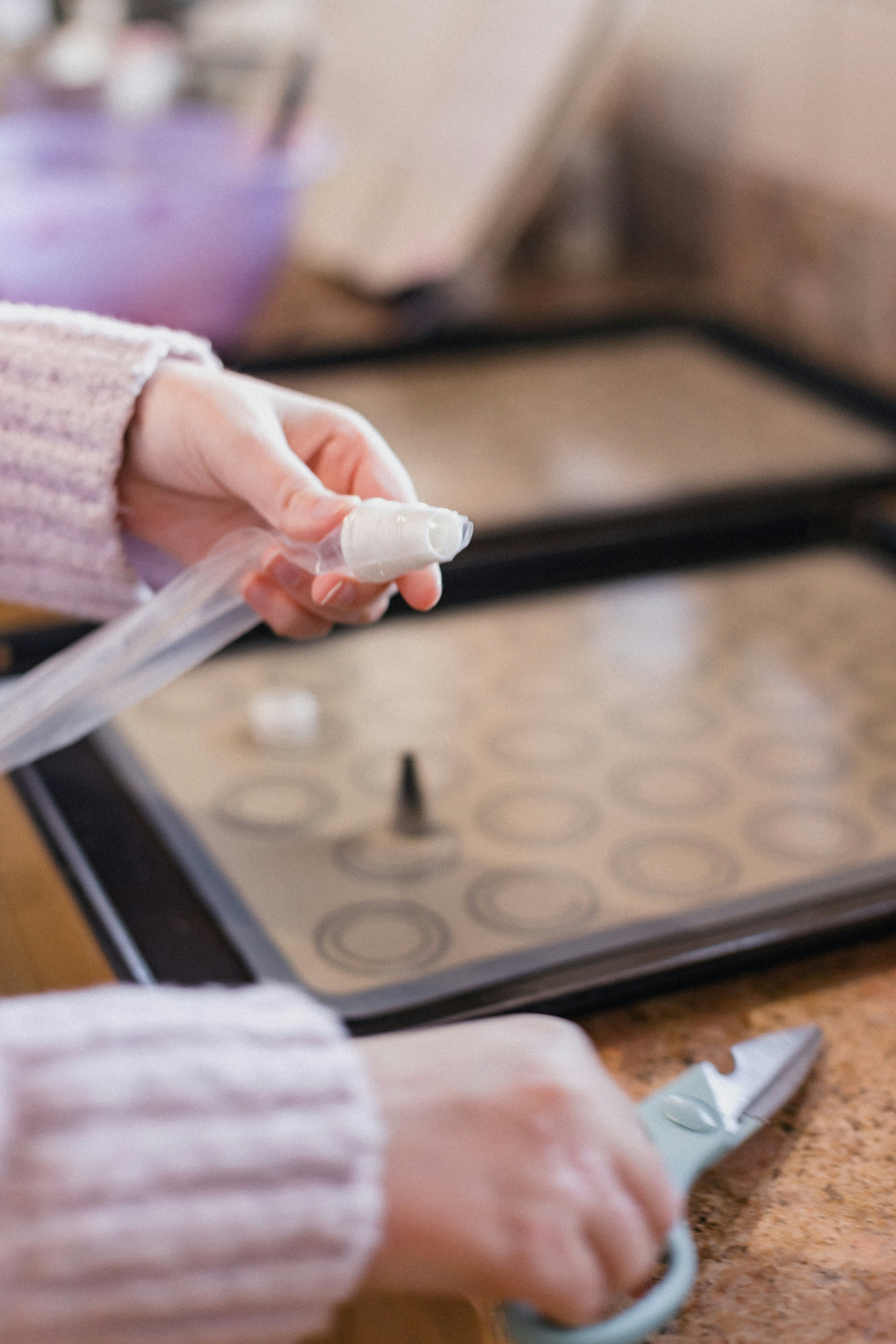 A baker adjusting the temperature control on a commercial griddle