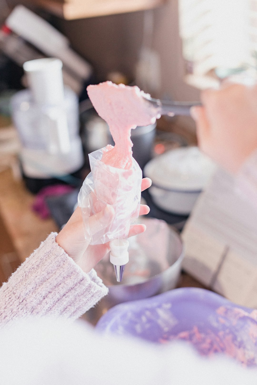 person holding white plastic ice cream scoop