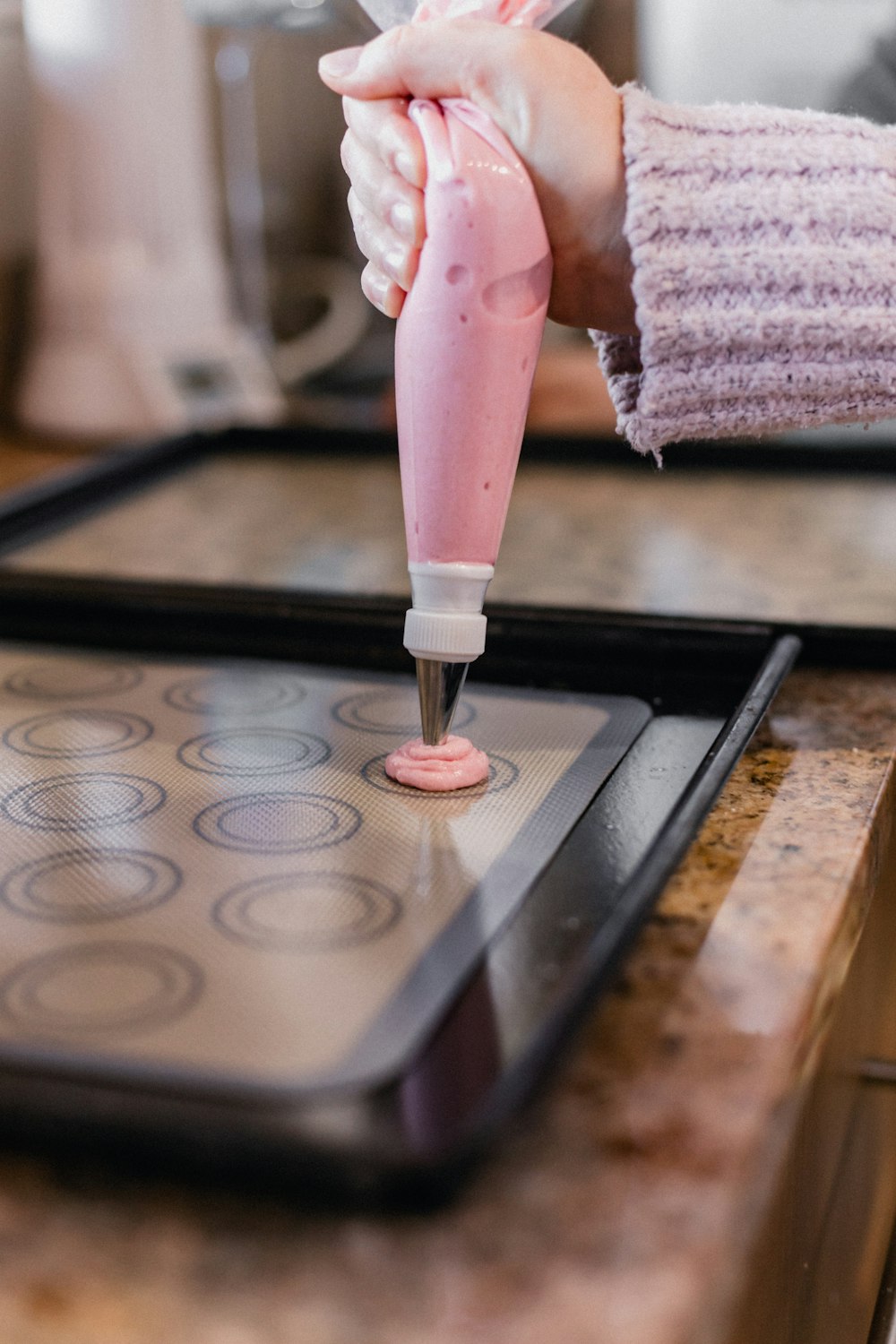 person holding pink ice cream