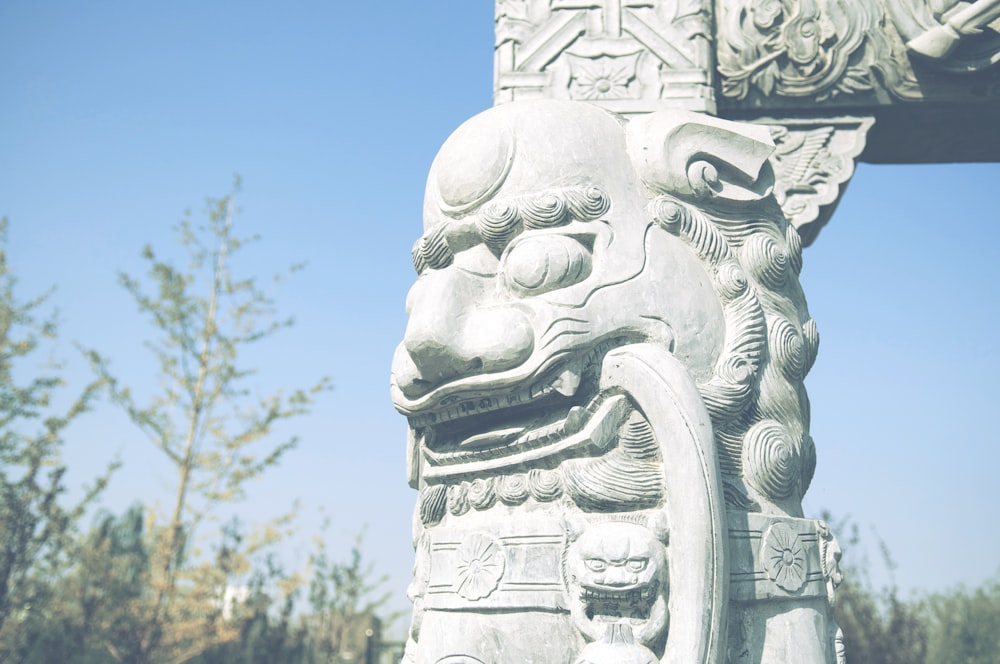 gray concrete statue during daytime