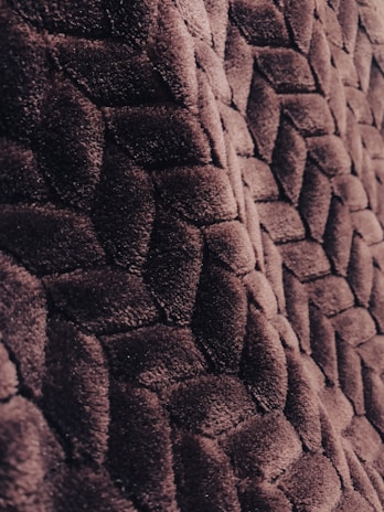 A close-up of a luxurious fabric swatch with intricate patterns.