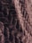 A close-up of a luxurious fabric swatch with intricate patterns and textures.