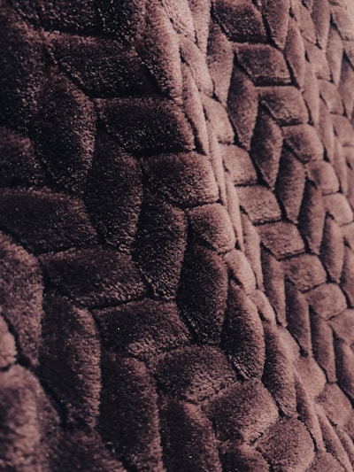 A close-up shot of a luxurious fabric texture from Platonius's latest collection.