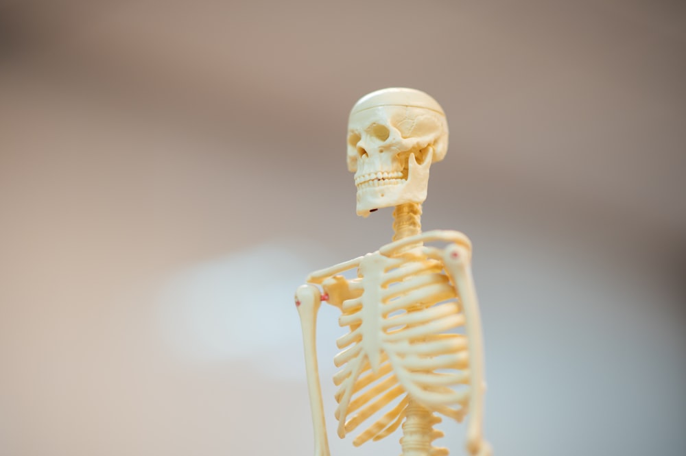 white ceramic figurine of a man